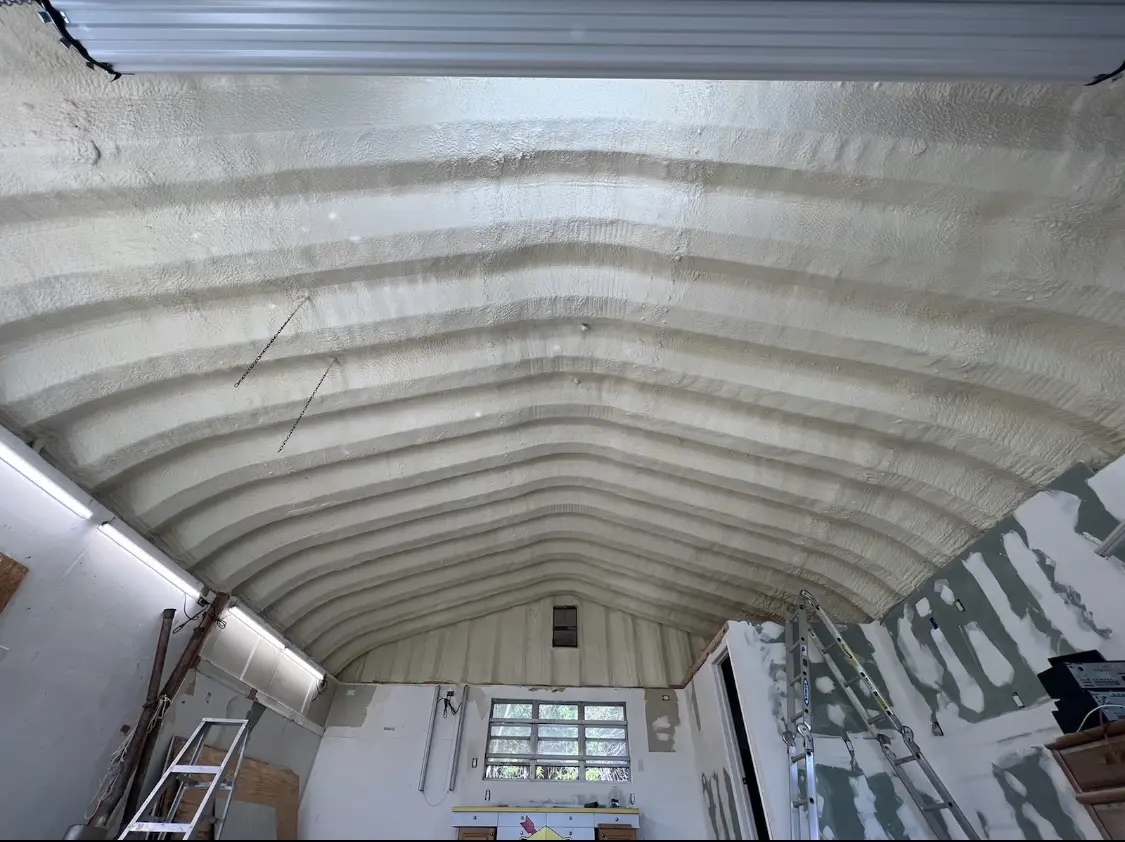 Spray polyurethane foam applied to the underside of a metal roof deck in Viera West